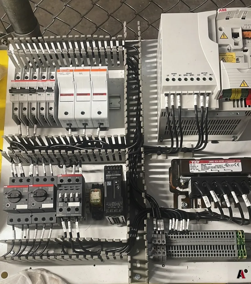 Industrial control panel with variable frequency drives, breakers, contactors and neatly routed wiring, designed by A1 Design and Construction