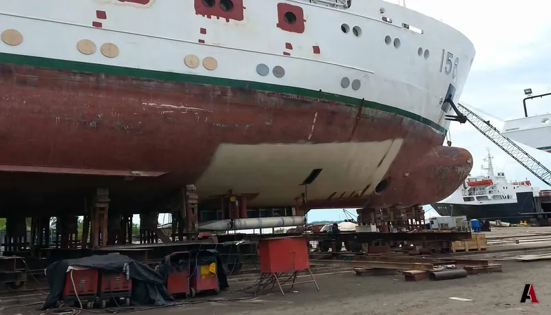 Ship bow on blocks in a dry dock during hull steel repair, designed by A1 Design and Construction