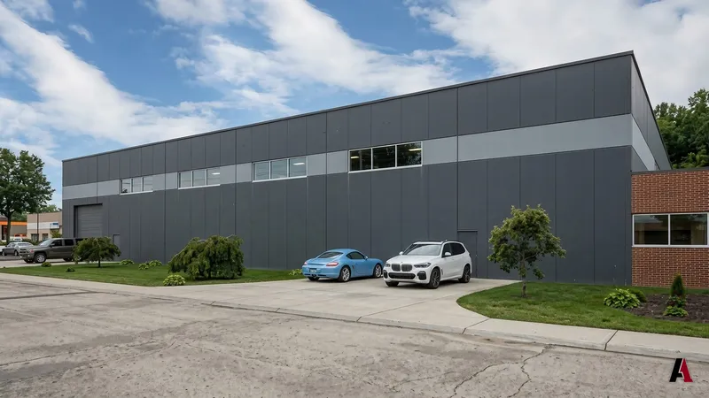 Photorealistic rendering of a dark metal panel warehouse with a clerestory window band next to a brick office, designed by A1 Design and Construction